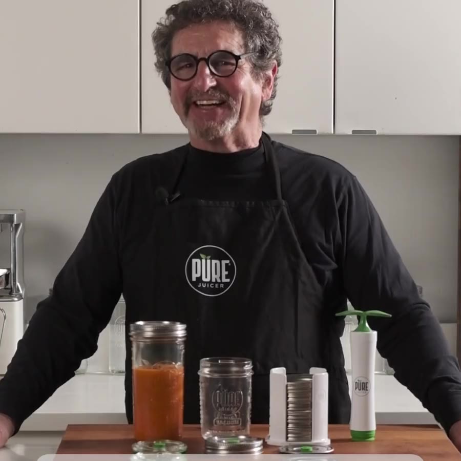The PURE MVP pump beside a sealed jar of green juice