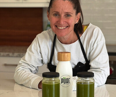 Chef Becky Aronchick with jars of frozen cold-pressed juice