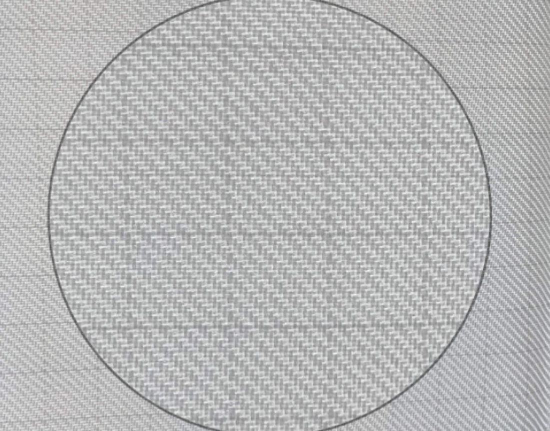 Close view of woven ripstop press cloth with a circle marked on it