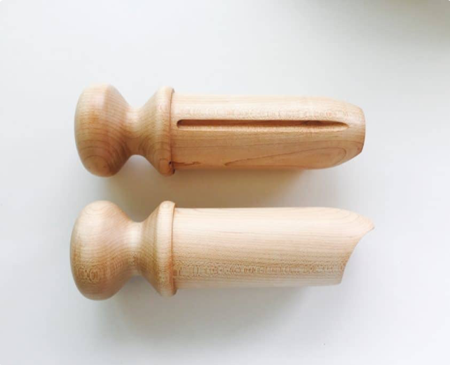 Two maple wood pushers, one with a slotted side and one with a shaped cutout end