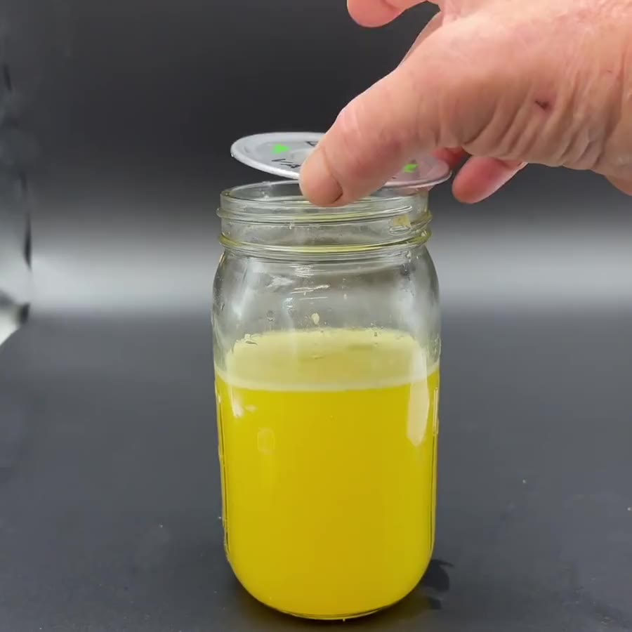 Setting a PURE stainless valved lid on a wide-mouth mason jar