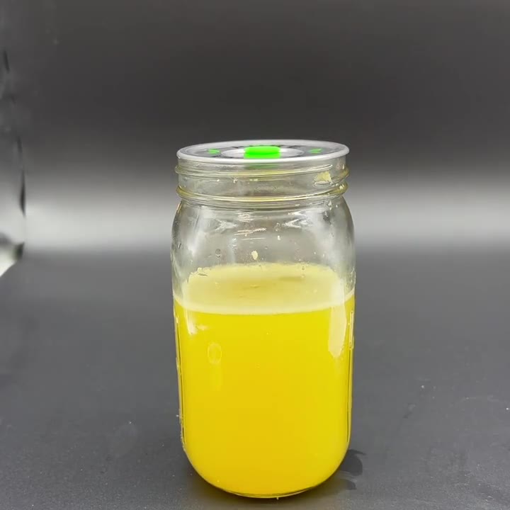 Stainless lid placed on a wide-mouth mason jar